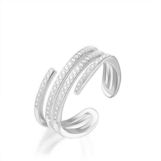Bague ouverte ajustable multi-rangs en acier inoxydable argenté pavée de strass scintillants REF 291.