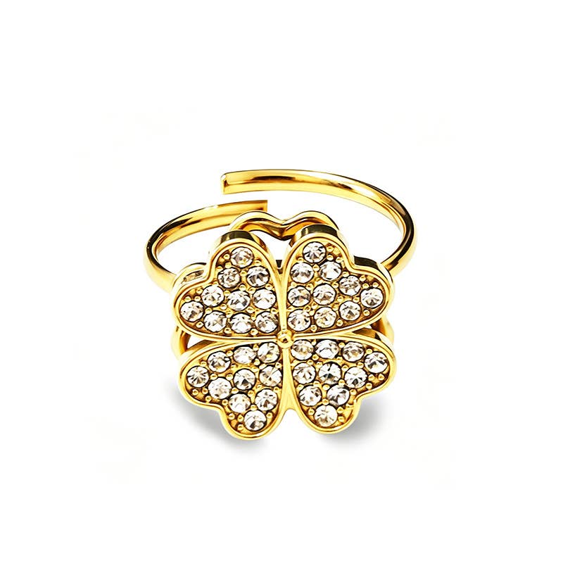 Bague anti-stress ajustable en acier inoxydable doré, ornée d'un trèfle à quatre feuilles rotatif pavé de cristaux brillants.