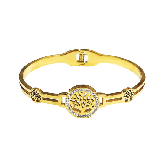 Bracelet jonc rigide doré pour femme avec un médaillon central Arbre de Vie entouré de strass brillants et deux motifs arbres ciselés sur les côtés.