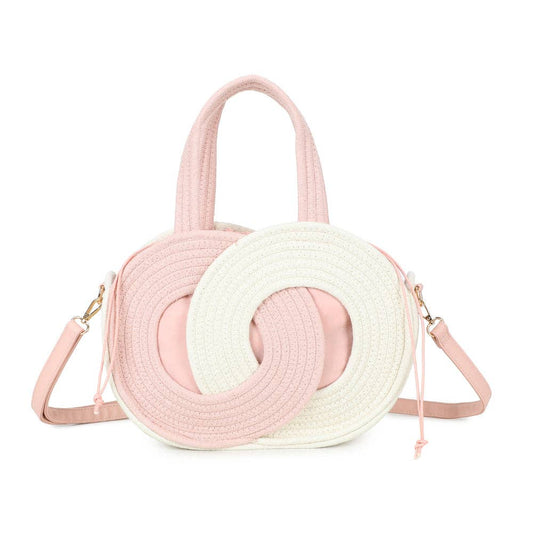 Sac à main rond Orélya en corde tressée rose poudré et blanc (REF 38), mettant en valeur le design de cercles imbriqués, les poignées en corde et la bandoulière rose assortie, isolé sur fond blanc.
